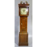 A C19th oak and mahogany banded longcase clock having a broken swan neck pediment above a square