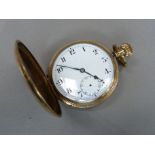 A pocket watch c.1930 in rolled gold hunter case, Swiss keyless jewelled movement, white enamel dial