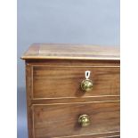 A George III mahogany chest of drawers, the top with cross grain frame and line inlaid, line