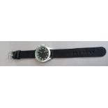 A 1950's Swedish air force style wristwatch in matte steel case, quartz motif, black dial,
