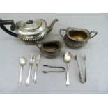 An Edward VII silver individual tea service, comprising tea pot sugar and cream of half lobed design