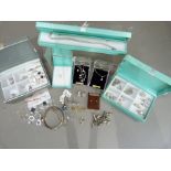 A group of silver and silver gilt jewellery including a bangle, charm bracelet, earrings, rings