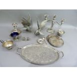 A quantity of silver plate, including a pair of fighting cocks, three light candelabra, two