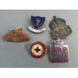 An ARP badge in silver c1938 together with a chrome and red enamel WVS ARP badge and other badges