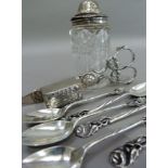 A silver lidded cut glass sugar caster (chipped), a set of six .800 silver teaspoons with rose