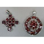Two garnet cluster pendants both in silver