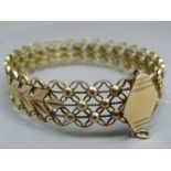 A pierced and beaded bangle c1950 in yellow metal (tests as 9ct gold), approximate weight 19gm