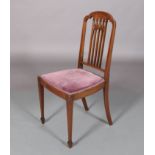 An Edward VII mahogany single chair inlaid with boxwood stringing, having an arched top rail above a