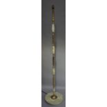 An onyx and gilt metal standard lamp of column form with circular base, 140cm high
