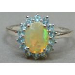 An opal and aquamarine cluster ring in silver