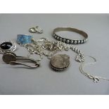 A small collection of silver jewellery including a jet brooch, bangle and enamel ring, total