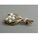 A pearl and diamond set spray brooch in 9ct gold (a/f), missing one 3mm pearl, approximate weight 3g