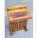 A late Victorian inlaid burr walnut veneered davenport with lidded superstructure the hinged lid