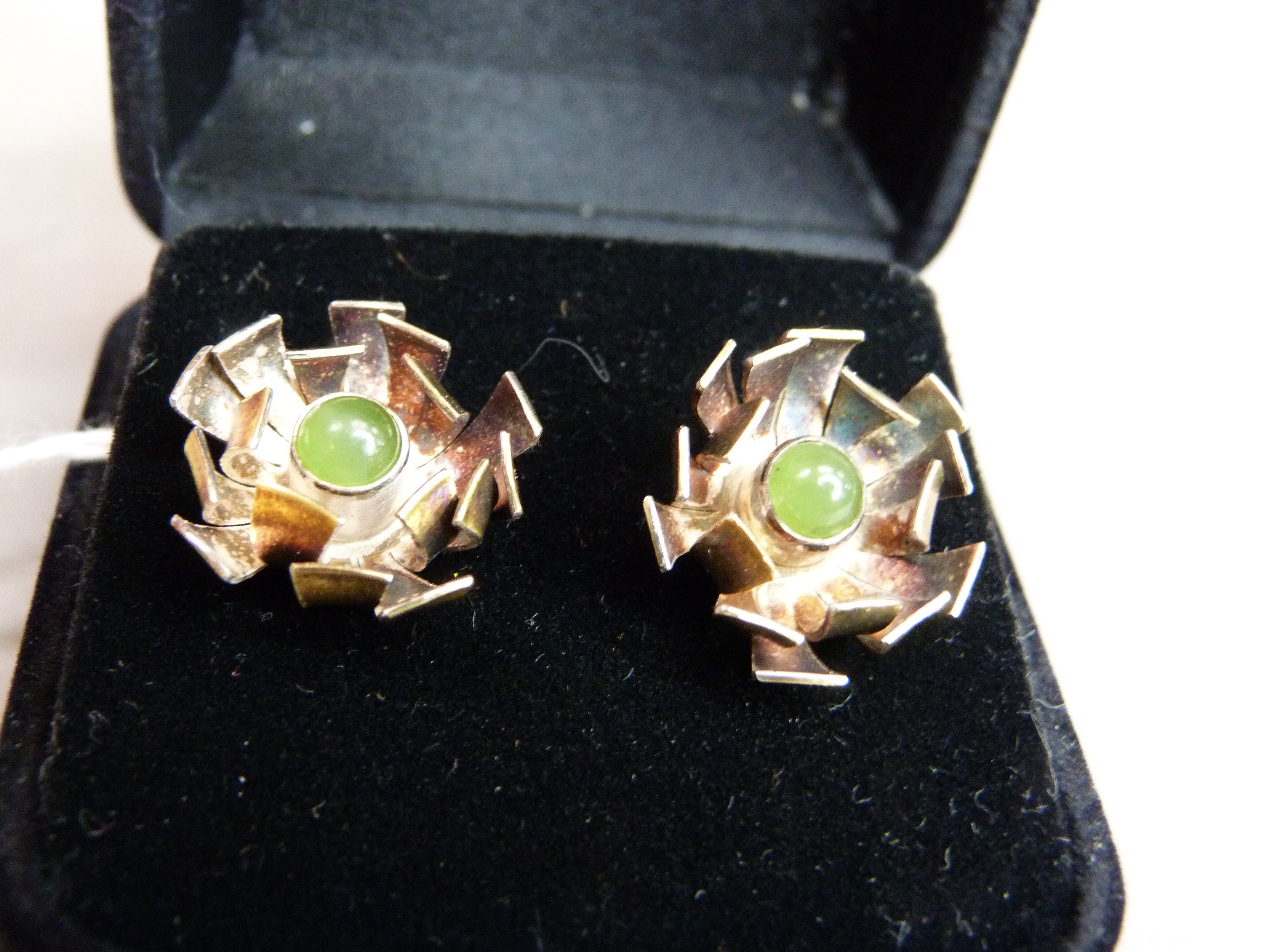 A pair of chrysoprase set ear studs in abstract foliate silver gilt, approx diameter 17mm;