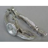 A lady's Sekonda quartz wristwatch, bracelet, earrings and pendant suite all set with colourless