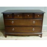 A Stag minstrel chest of four small drawers and two long drawers with button and ring handles on