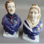 A pair of Royal Worcester candle snuffers modelled as a bust of Queen Victorian and of Prince