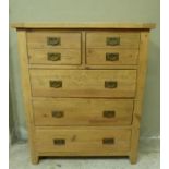 A reproduction pine chest the rectangular top above two deep drawers modelled as four, three further