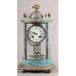 A FRENCH LATE 19TH CENTURY BRASS CASED AND CHAMPLEVE ENAMELLED FOUR GLASS MANTEL CLOCK, decorated