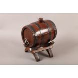 A LATE 19TH CENTURY FRENCH BRANDY BARREL metal bound coopered oak with silver plated spigot, later