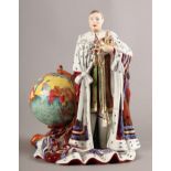 A CARLTON WARE FIGURE OF EDWARD VIII in coronation robes holding the crown, standing beside a