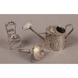 MINIATURES - A DUTCH SILVER EMBOSSED WATERING CAN, 3.5cm high, a silver funnel and a chair, the rush