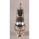 A VICTORIAN SILVER CASTOR, of lobed and girdled baluster form with bud finial and on raised circular