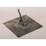 OF GARDENING INTEREST: A LATE 18TH CENTURY BRONZE SUN DIAL, square outline, engraved with central
