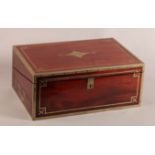 A FINE EARLY 19TH CENTURY BRASS BOUND MAHOGANY WRITING SLOPE, the hinged lid with foliate tipped