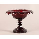 A RUBY CASED CUT GLASS TAZZA of everted shallow urnular form, the rim star, oval and flute cut,