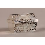 A 19TH CENTURY SILVER MOUNTED MOTHER OF PEARL PILL BOX of geometric domed casket form, the lid,