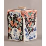 A RARE 18TH CENTURY DUTCH DELFT TEA CADDY of square form, polychrome decorated with alternate panels