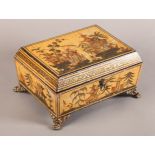 A REGENCY PAINTED WOODEN SEWING BOX, decorated overall with chinoiserie scenes on a cream/yellow