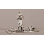 MINIATURES - A DUTCH SILVER GROUP OF A WOMAN FEEDING FIVE CHICKENS, engraved rectangular base, 4.5cm