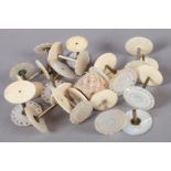OF SEWING INTEREST ? FIFTEEN EARLY 19TH CENTURY MOTHER OF PEARL FACED BOBBIN HOLDERS of floret