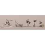 MINIATURES - THREE DUTCH SILVER CAST METAL FIGURES of young boys with pipes and trumpets, all