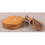 A 19TH CENTURY FRUITWOOD BUTTER MOULD AND WHEEL carved with a thistle 13.5cm long and with band of