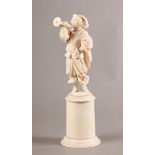 A 19TH CENTURY DIEPPE IVORY FIGURE OF A BUGLER, wearing 17th century style attire, a sword at his