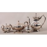 A JAPANESE STERLING SILVER .950 FIVE PIECE TEA AND COFFEE SET by K. Uyeda c.1950 of compressed