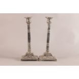 A PAIR OF SILVER PLATED CLUSTER COLUMN TABLE CANDLESTICKS with egg and dart cast detachable nozzles,