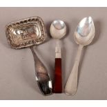 A DUTCH SILVER SIFTER SPOON having a pierced rectangular bowl with reel cast border, tapered stem, a