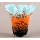 AN ART GLASS VASE in the style of Monart/Vasart, the dark blue base with speckled orange band