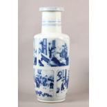 A CHINESE BLUE AND WHITE ROULEAU VASE, the body painted with three large rectangular reserves one