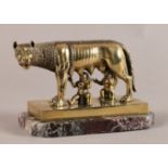 A 19TH CENTURY BRASS MODEL OF ROMULUS AND REMUS suckling from the she wolf, rectangular base and