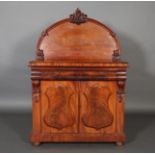 A VICTORIAN MAHOGANY CHIFFONIER, the arched panelled back with central foliate carved cresting,