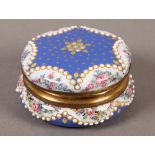 A 19TH CENTURY FRENCH ENAMEL BLUE BOX, circular, the cover centred with a pearl bead set flower