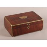 A 19TH CENTURY CONTINENTAL BRASS BOUND MAHOGANY BOX of rounded rectangular form, the lid with