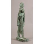 A BRONZE FIGURE OF SEKHMET, cast as a standing female figure with lions head, a circular disc