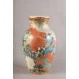 A JAPANESE POTTERY VASE, Meiji period, finely polychrome enamelled with chrysanthemum between
