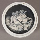 A MID 19TH CENTURY IVORY BOX, circular, the lid inset with a monochrome painting of cherubs